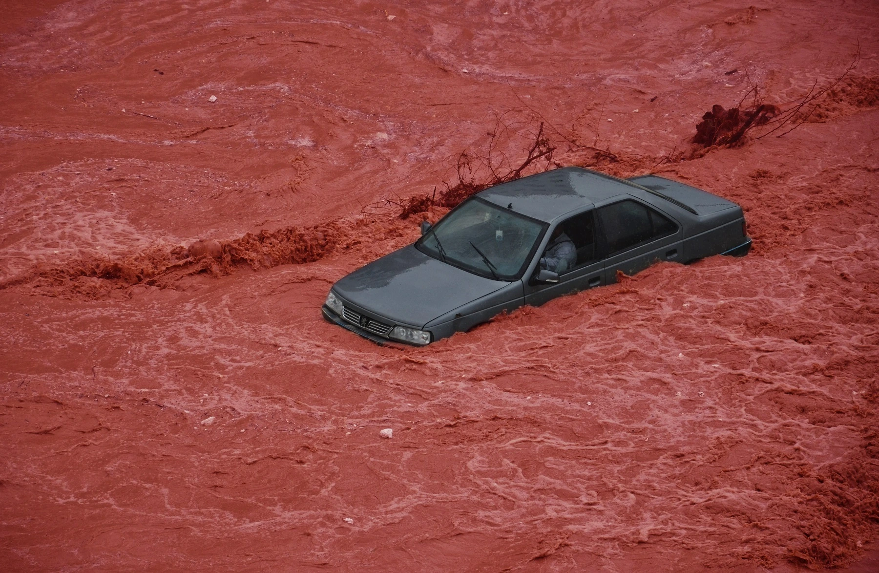 Hard Way, a car caught in a red flood